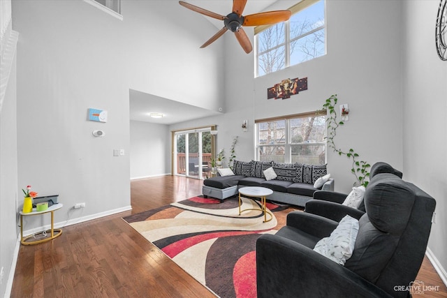 living room featuring hardwood / wood-style flooring and ceiling fan