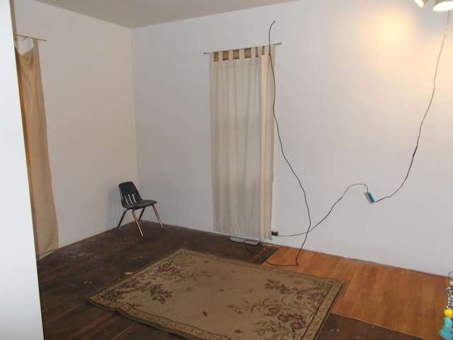 unfurnished room featuring dark hardwood / wood-style flooring