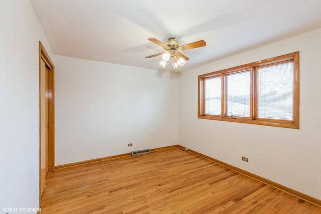 spare room featuring ceiling fan and light hardwood / wood-style floors