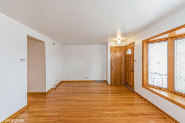 unfurnished room featuring light hardwood / wood-style floors