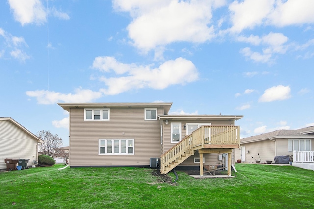 back of property featuring a wooden deck, a yard, and central air condition unit