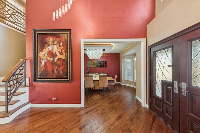 entrance foyer featuring french doors and wood-type flooring