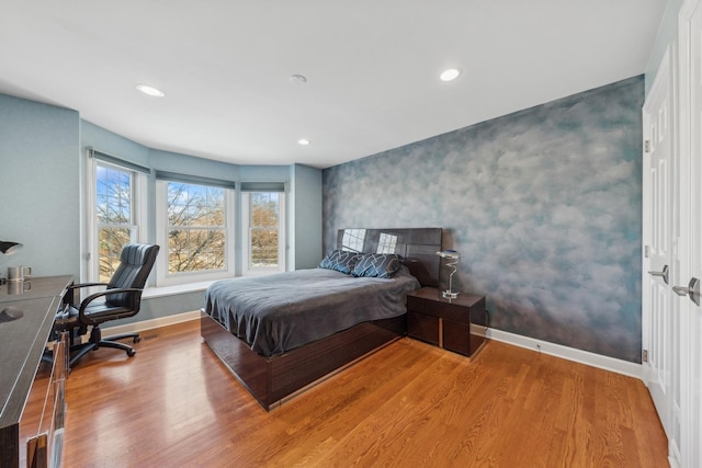 bedroom with hardwood / wood-style flooring