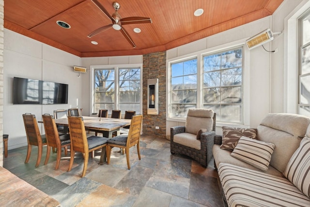 dining space with ceiling fan and wooden ceiling