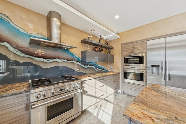 kitchen with backsplash, wood counters, appliances with stainless steel finishes, wall chimney range hood, and light tile patterned flooring