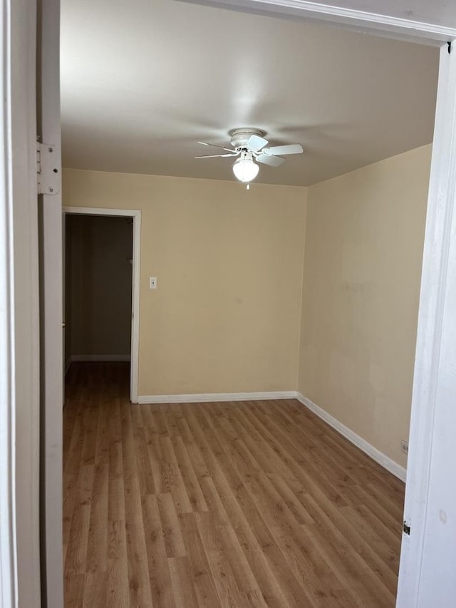 spare room with ceiling fan and light hardwood / wood-style floors