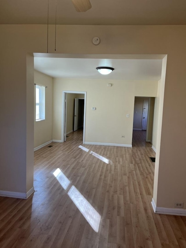 empty room with light hardwood / wood-style flooring