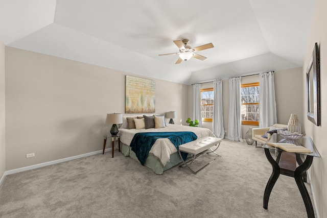 carpeted bedroom featuring vaulted ceiling, baseboards, and ceiling fan