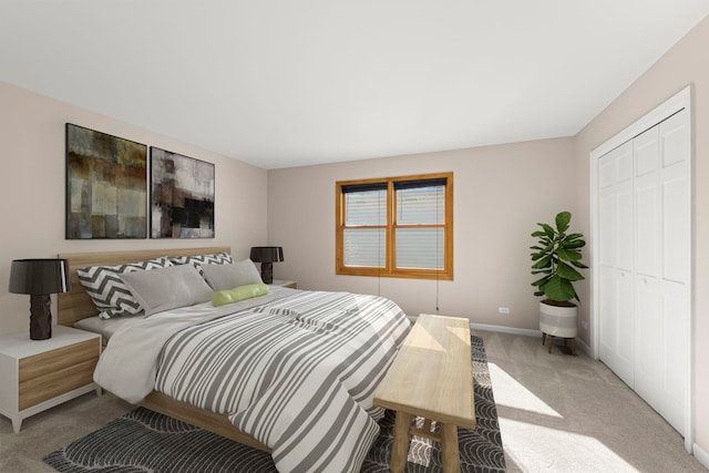 bedroom featuring baseboards, a closet, and light colored carpet