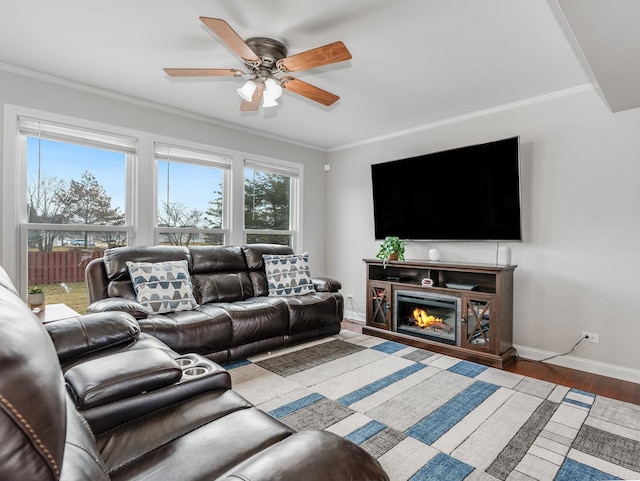 living room with crown molding, ceiling fan, and wood-type flooring