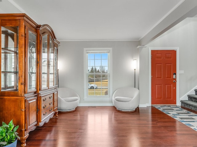 living area with ornamental molding and dark hardwood / wood-style flooring