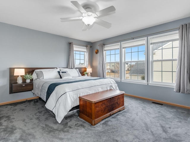 bedroom featuring ceiling fan and dark colored carpet