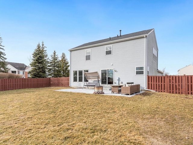 back of house featuring outdoor lounge area, a yard, and a patio area