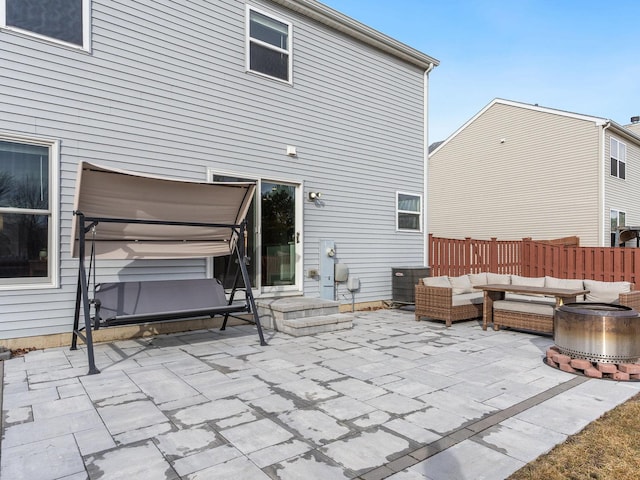 view of patio / terrace featuring an outdoor living space with a fire pit