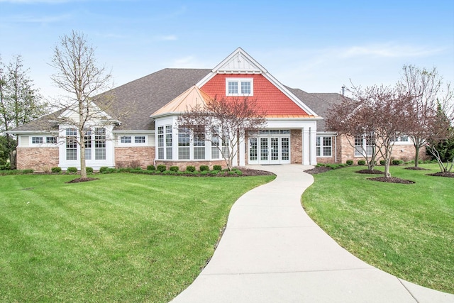 exterior space with a front yard and french doors