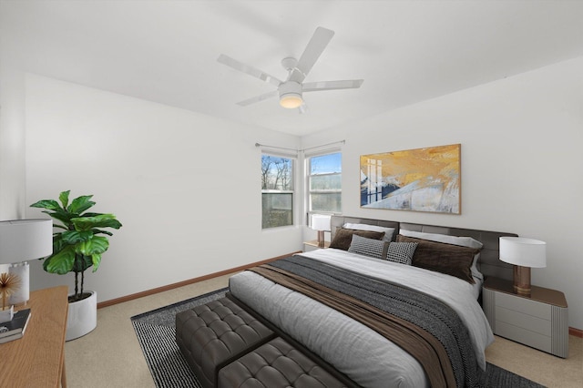 bedroom with ceiling fan and light colored carpet