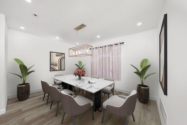 dining room featuring light hardwood / wood-style floors