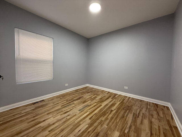 spare room featuring hardwood / wood-style floors