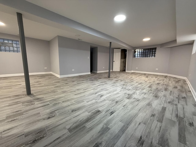 basement featuring light hardwood / wood-style floors