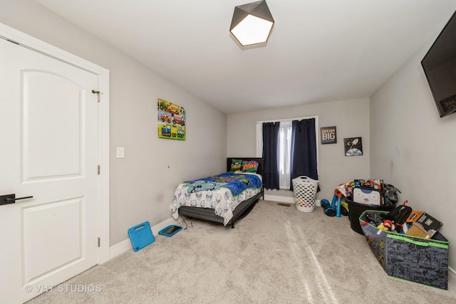 bedroom with light carpet