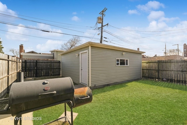 view of outbuilding featuring a lawn