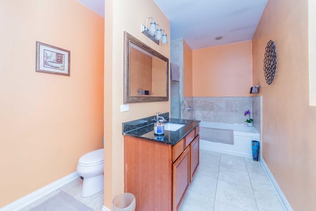 bathroom featuring tile patterned flooring, a bathing tub, vanity, and toilet