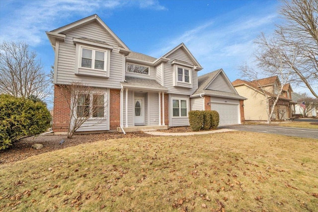 view of front property with a garage and a front yard