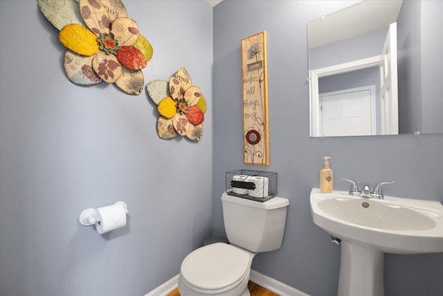 bathroom with sink and toilet