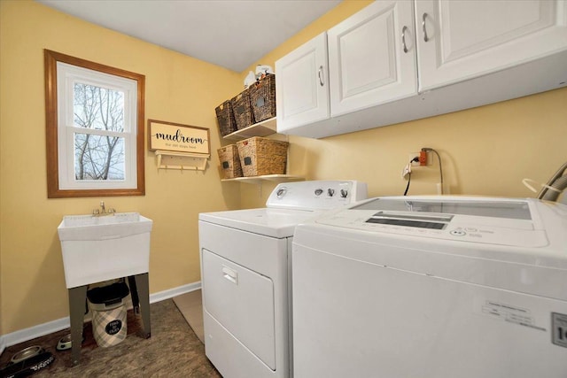 washroom with cabinets and separate washer and dryer