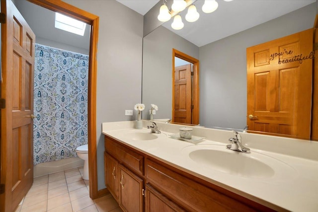 full bathroom featuring a chandelier, vanity, toilet, shower / bath combo, and tile patterned floors