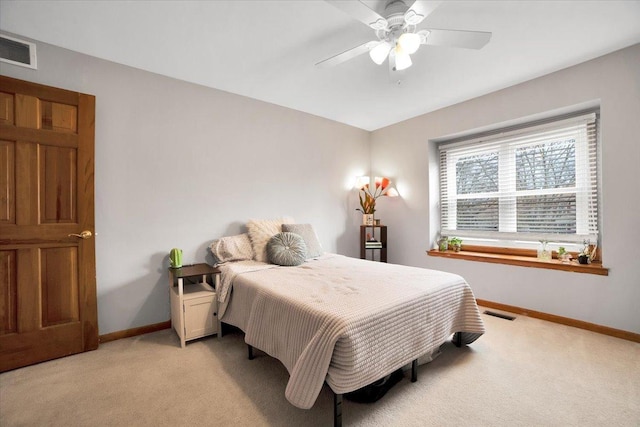 bedroom with light carpet and ceiling fan