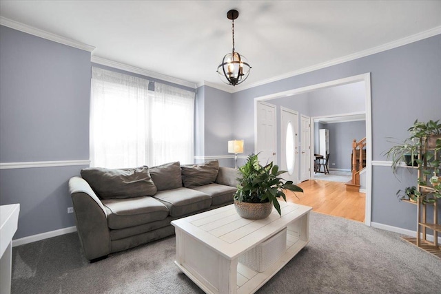 carpeted living room with an inviting chandelier and ornamental molding