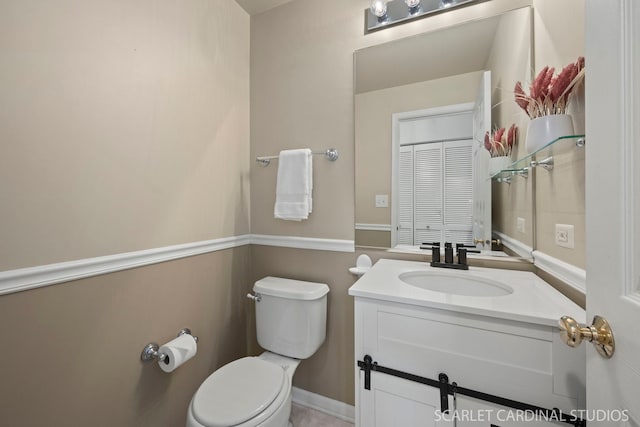 bathroom with vanity and toilet