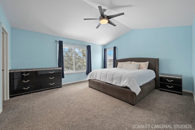 bedroom with ceiling fan, vaulted ceiling, and carpet