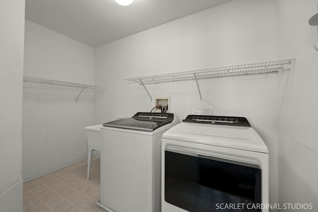 clothes washing area featuring washing machine and clothes dryer