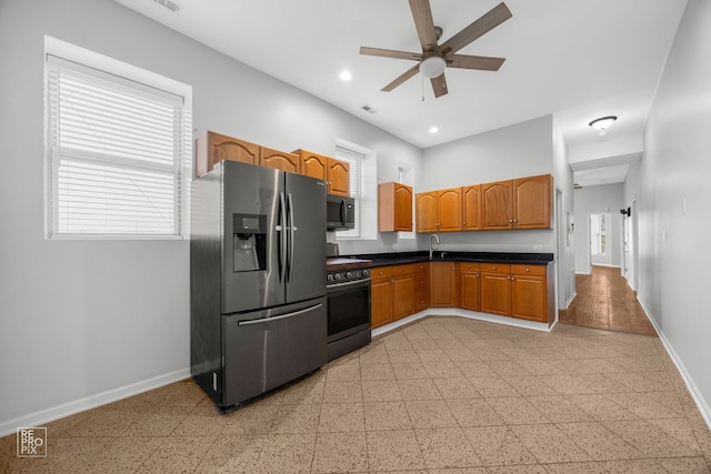 kitchen with sink, ceiling fan, and appliances with stainless steel finishes