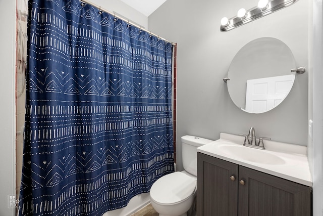 bathroom featuring vanity, curtained shower, and toilet