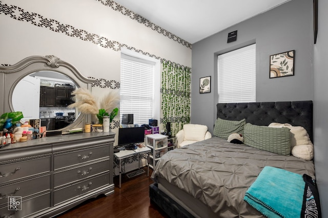 bedroom with dark wood-type flooring