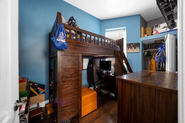 bedroom featuring dark hardwood / wood-style floors