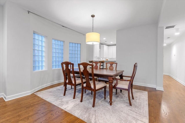 dining area with recessed lighting, dark wood finished floors, visible vents, and baseboards