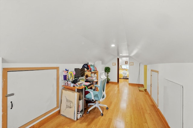 office space with hardwood / wood-style flooring and lofted ceiling