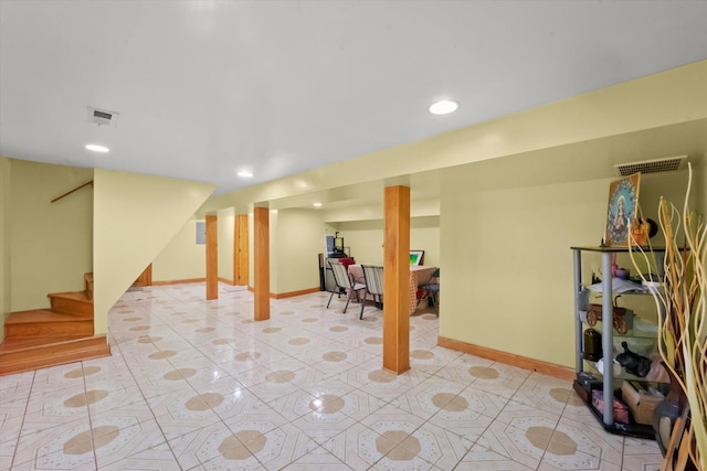 basement featuring light tile patterned floors