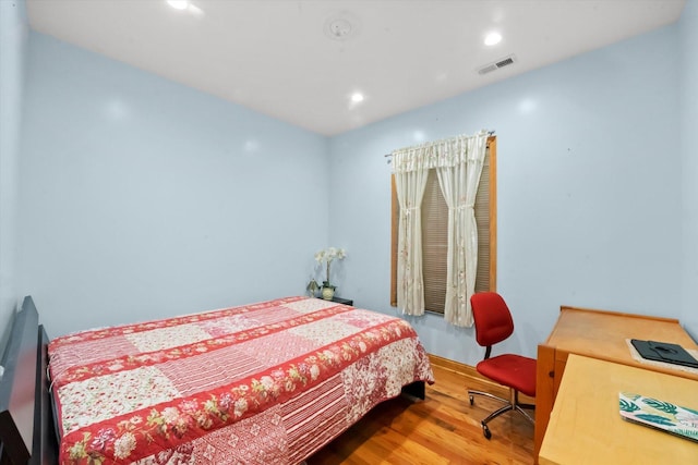 bedroom featuring hardwood / wood-style floors