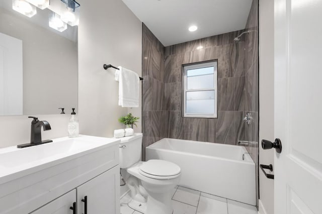 full bathroom featuring vanity, tiled shower / bath combo, and toilet