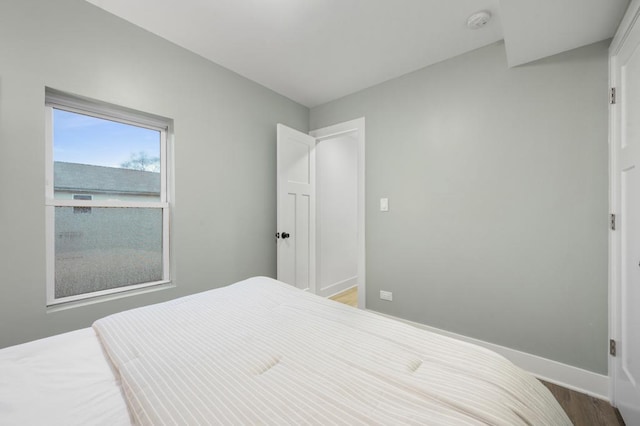 bedroom with hardwood / wood-style flooring