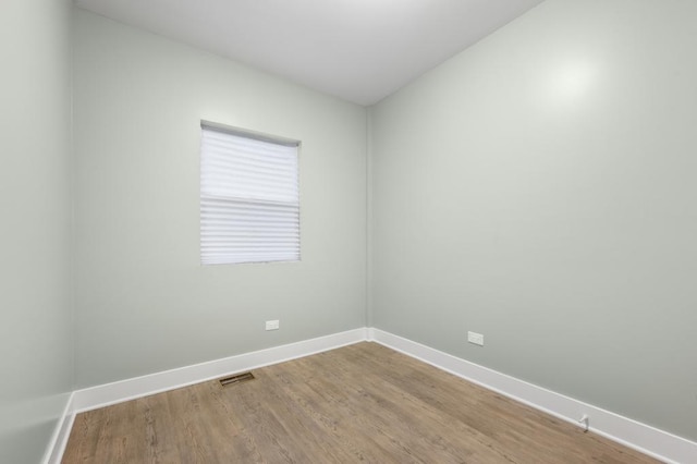 empty room featuring hardwood / wood-style flooring