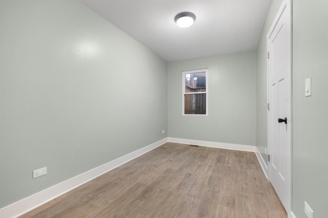 unfurnished room featuring light hardwood / wood-style floors