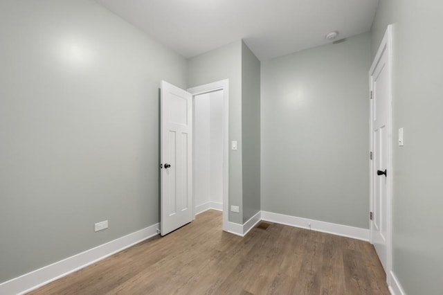 unfurnished bedroom featuring light wood-type flooring