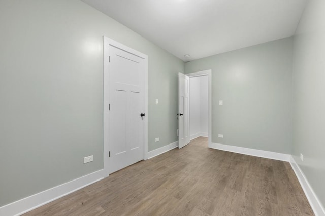 unfurnished room featuring light hardwood / wood-style floors