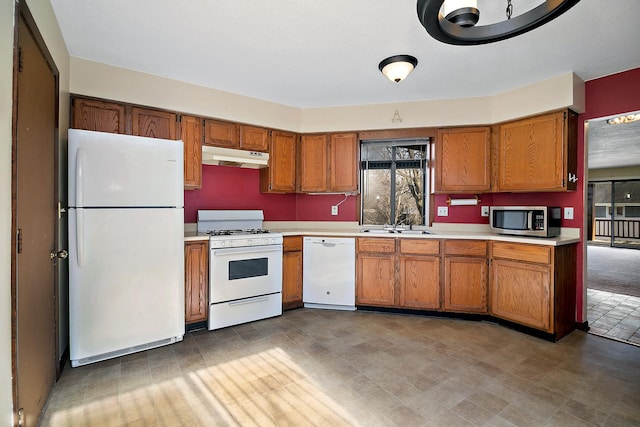 kitchen featuring sink and white appliances